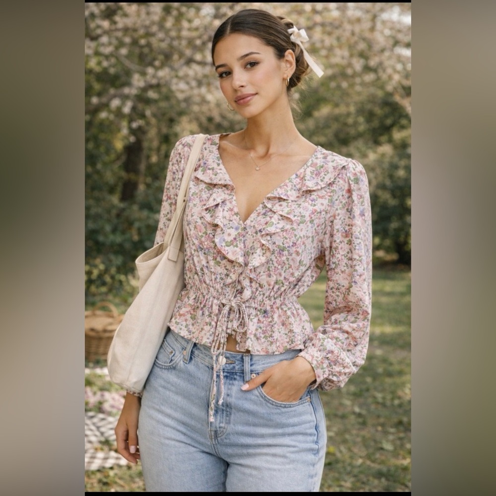 Lush pink floral cropped peasant top with a double tie front and ruffles
